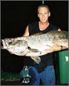 Beachmaster employee Brian rewarded with a prize Jewfish